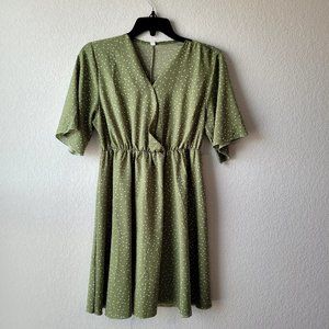Knee length green polka dot dress